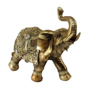 Escultura de elefante dourado com detalhes ricos e acabamento brilhante. Peça ideal para agregar charme, sofisticação e significados de sorte e prosperidade à decoração de interiores.